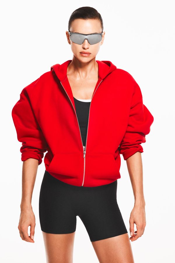 Chaqueta de deporte con capucha y cremallera