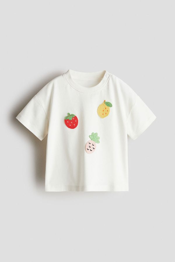 Camiseta con aplicaciones