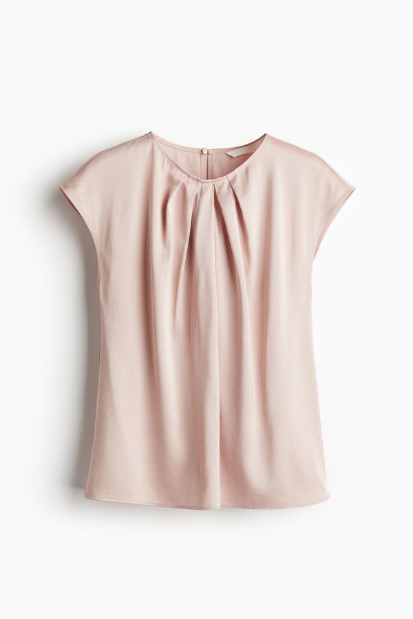 Blusa con pliegues