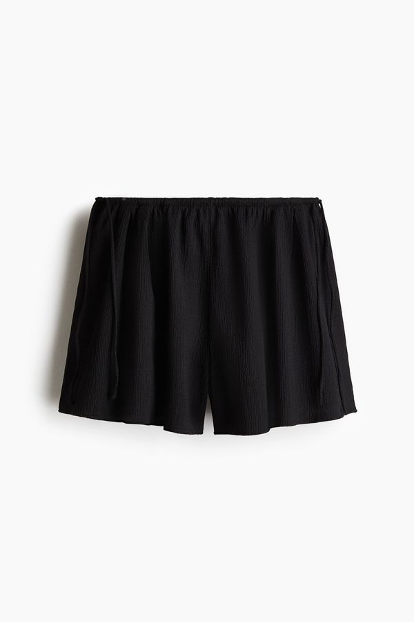 Pantalón corto de punto efecto arrugado