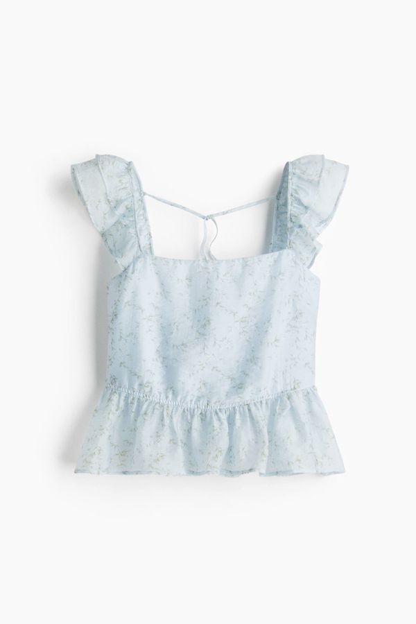 Blusa con lazada y peplo