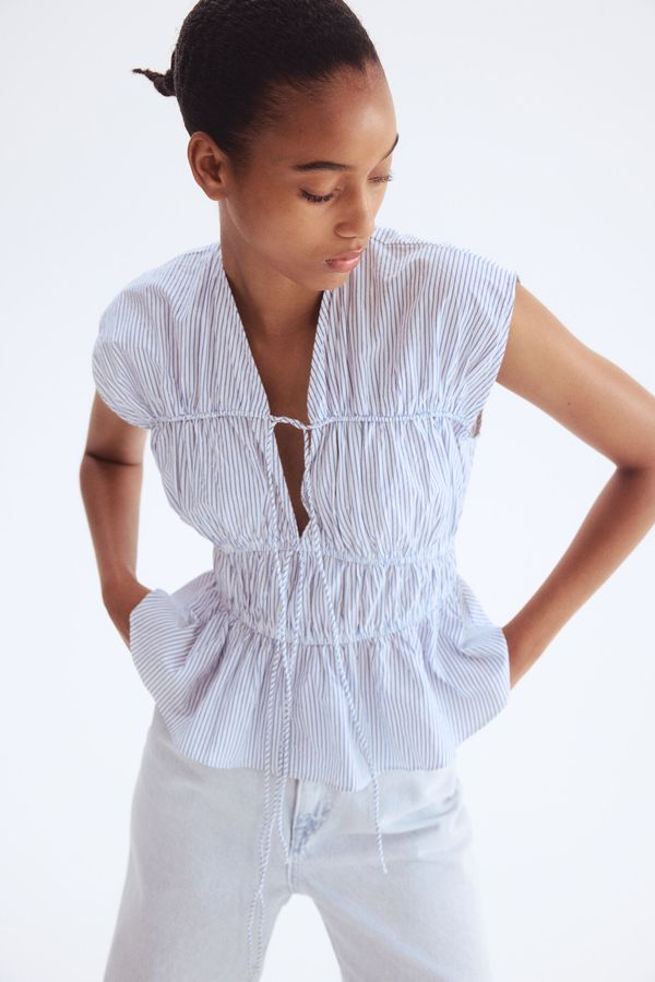 Blusa de popelina con cordón de ajuste