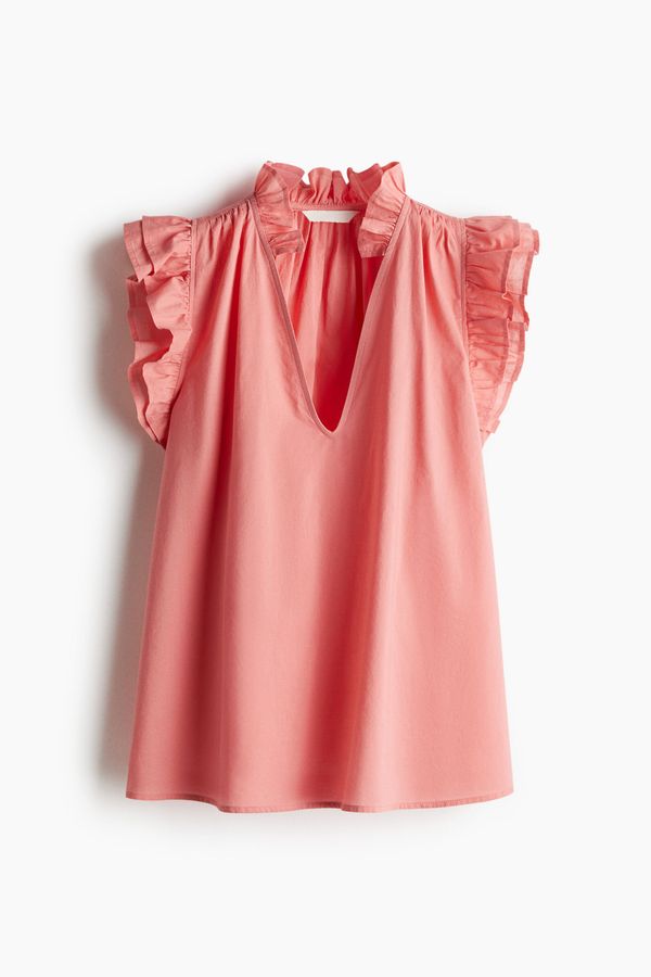 Blusa con ribetes de volante