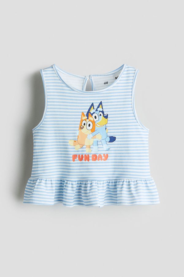 Camiseta con motivo estampado y peplo