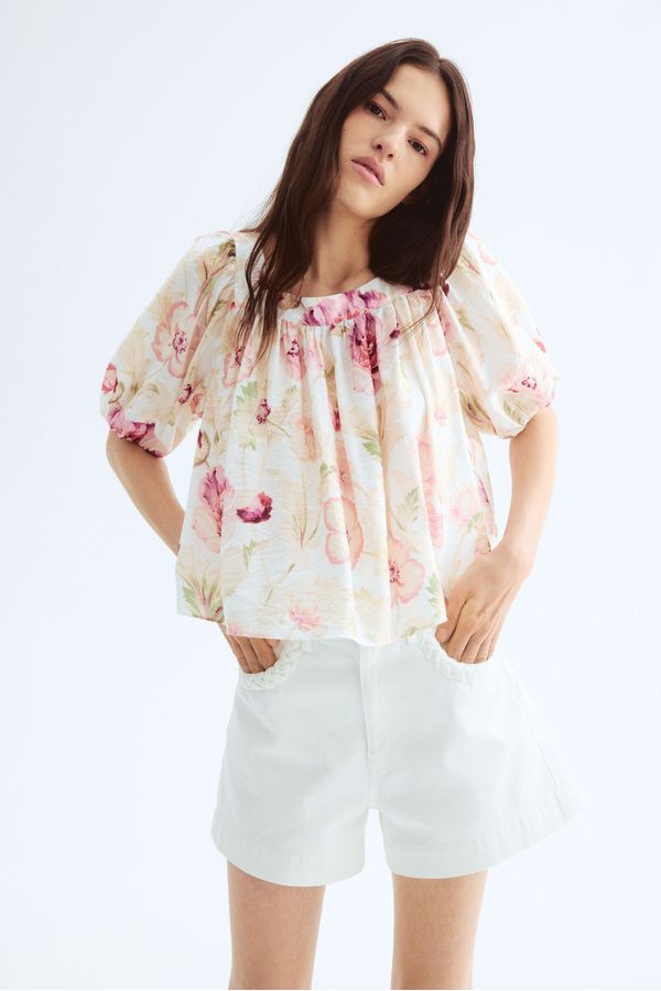 Blusa con mangas globo