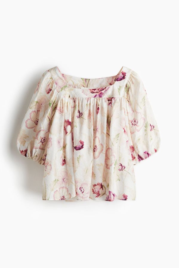Blusa con mangas globo