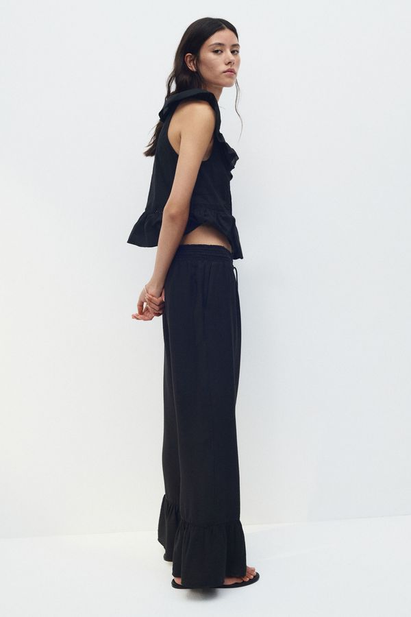 Pantalón con cordón de ajuste y ribete de volante