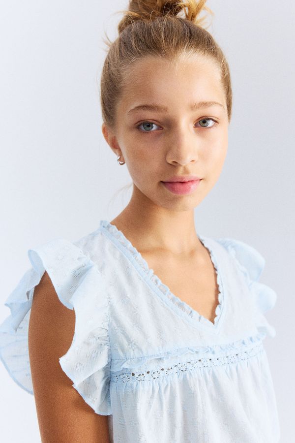 Frill-trimmed cotton blouse