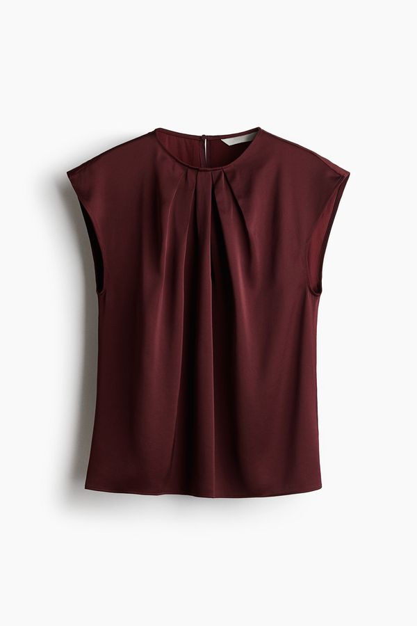 Blusa con pliegues