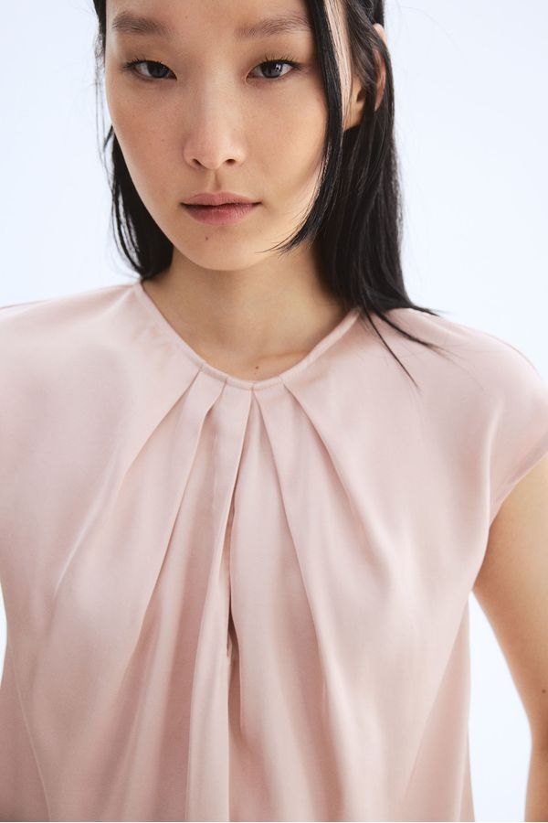Blusa con pliegues