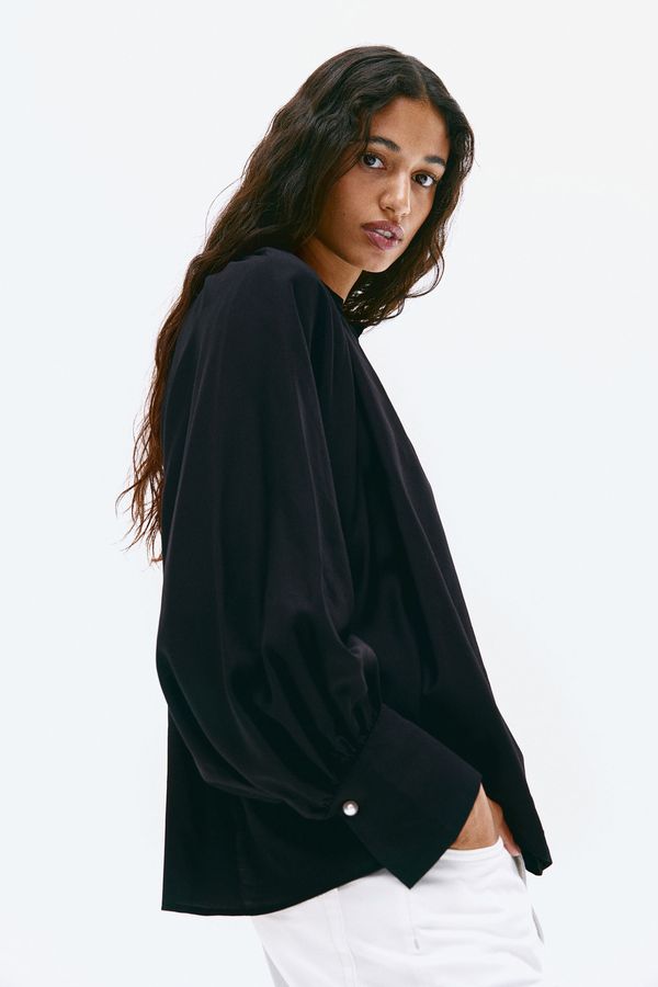 Blusa con mangas globo