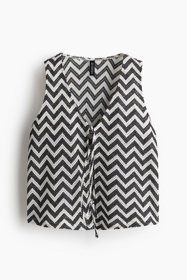 Chaleco en punto jacquard con lazada
