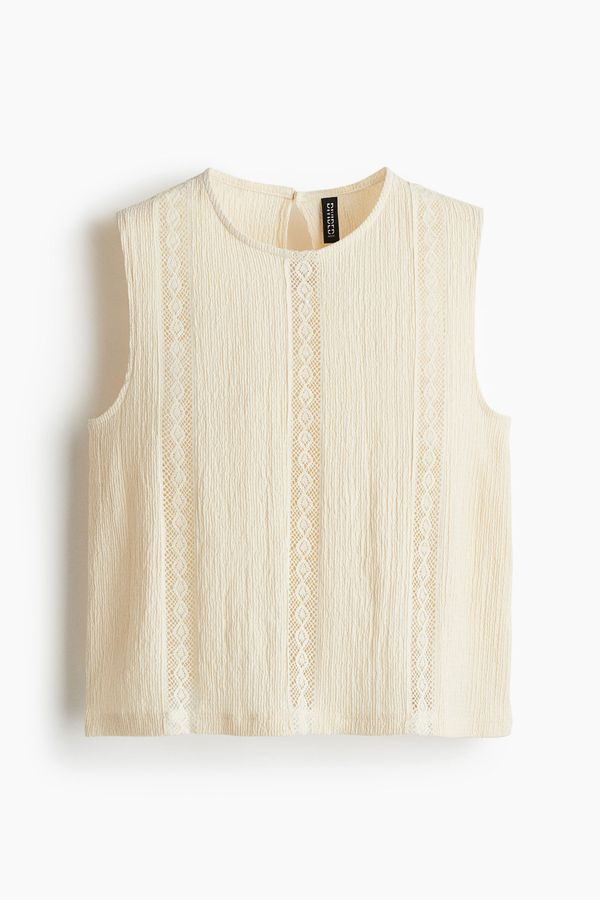 Blusa efecto arrugado con inserciones de encaje
