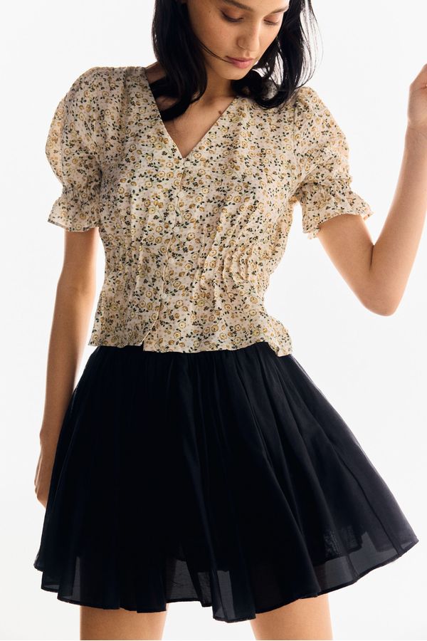 Blusa con peplo