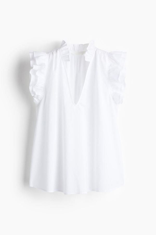 Blusa con ribetes de volante
